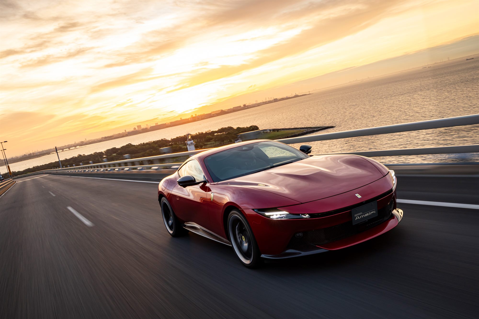 Ferrari Amalfi at sunset on an open road